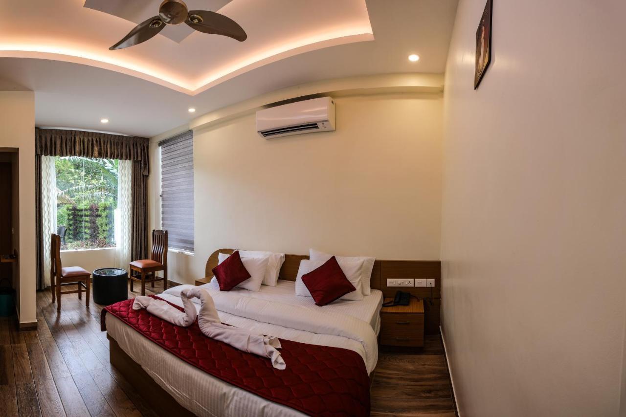 Thenmala Hormuz Inn Kolattupuzha エクステリア 写真
